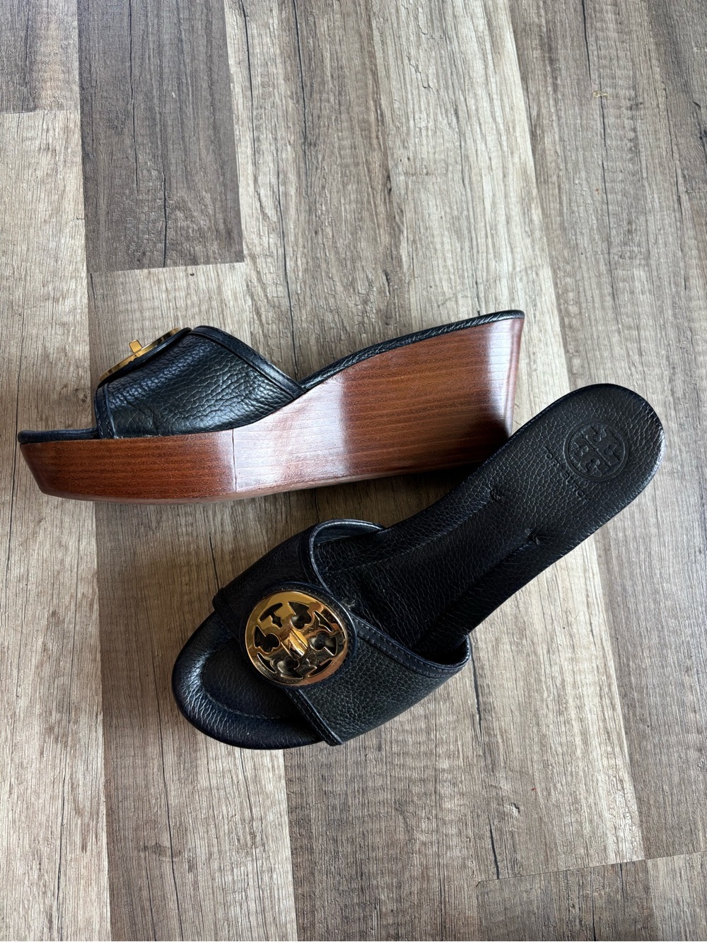 Tory Burch Black Leather Wedge Mules with Gold Logo Medallion